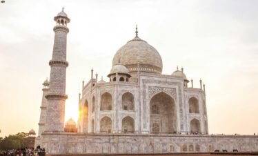 Stunning view of the Taj Mahal at sunset, highlighting its architectural beauty.