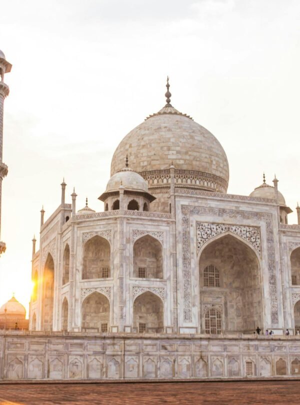 Stunning view of the Taj Mahal at sunset, highlighting its architectural beauty.